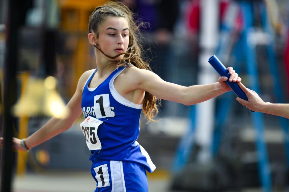 Sioux Falls Christian's Ellie Maddox receives the baton from a teammate during the Howard Wood Dakota Relays on Friday, May 6, 2022, in Sioux Falls.