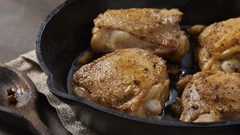 Chicken thighs in pan