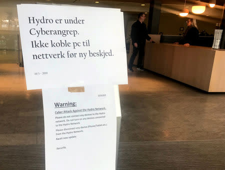 A sign warning employees not to connect devices to the network in the wake of a cyber attack is seen at the headquarters of aluminum producer Norsk Hydro in Oslo, Norway March 19, 2019. REUTERS/Gwladys Fouche