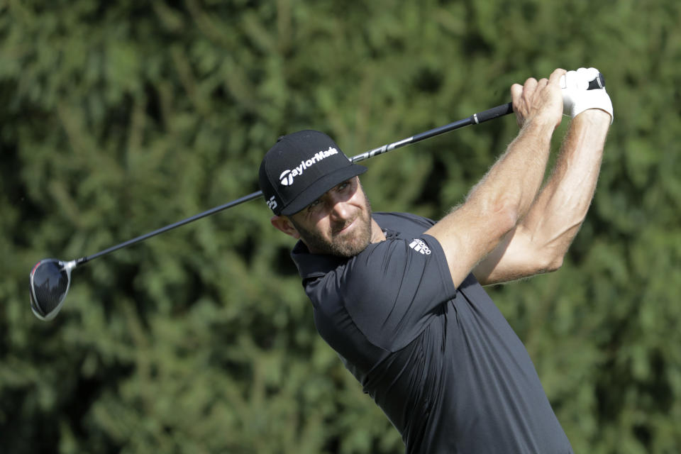 Dustin Johnson tees off on the 14th hole during the first round of the Northern Trust golf tournament, Thursday, Aug. 23, 2018, in Paramus, N.J. (AP Photo/Julio Cortez)