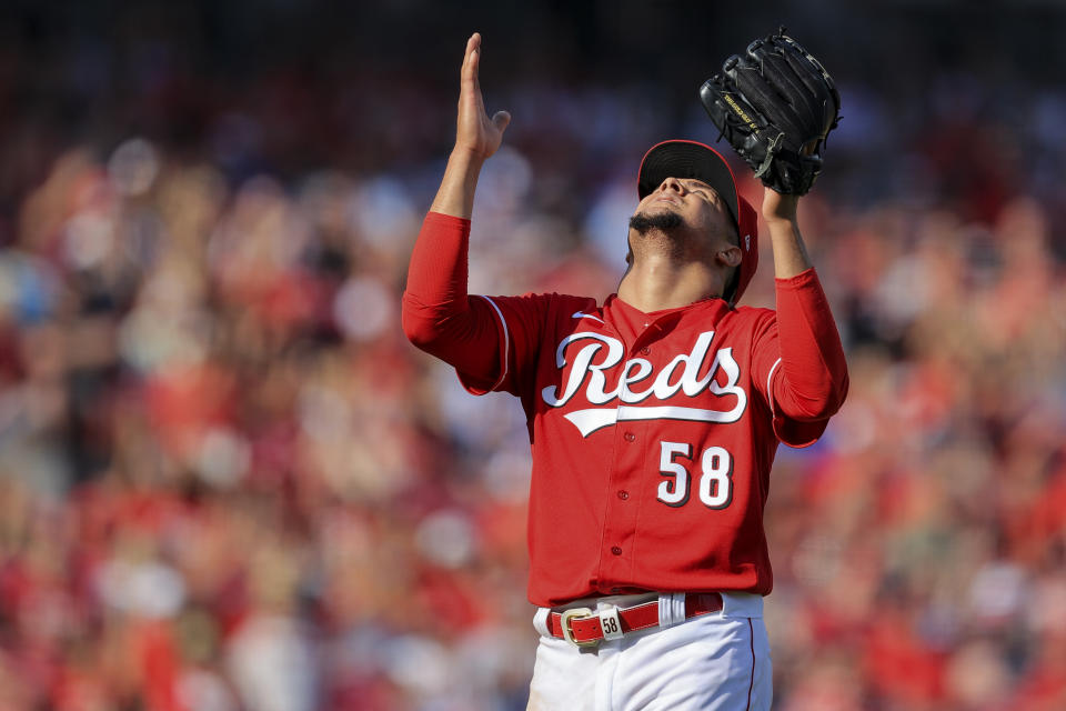 Cincinnati Reds' Luis Castillo reacts as he leaves the field during the seventh inning of a baseball game against the Atlanta Braves in Cincinnati, Saturday, June 26, 2021. (AP Photo/Aaron Doster)