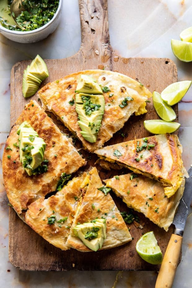 <p>Soft scrambled eggs, crispy bacon, chipotle peppers, cheese and spinach, stuffed into flour tortillas and cooked until golden, crisp, and oh so perfect.</p><p><strong>Get the recipe: <a href="https://www.halfbakedharvest.com/breakfast-quesadilla/" rel="nofollow noopener" target="_blank" data-ylk="slk:Breakfast Quesadilla with Soft Scrambled Eggs and Avocado Salsa" class="link "><em>Breakfast Quesadilla with Soft Scrambled Eggs and Avocado Salsa</em></a></strong></p><p>Half Baked Harvest</p>