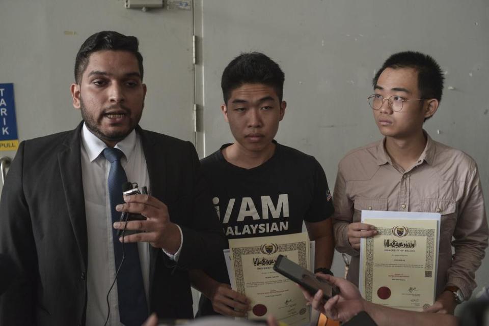 (From left) Legal representative Asheeq Ali, student activist Wong Yan Ke and Edan Kon speak during a press conference outside University of Malaya’s examination hall in Kuala Lumpur October 19, 2019. ― Picture by Shafwan Zaidon