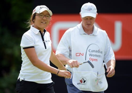Amateur Lydia Ko of New Zealand smiles as she leaves the 15th green during round two of the Canadian Women's Open at The Vancouver Golf Club on August 24 in Coquitlam, Canada. Ko fired a second-straight four-under par 68 on Friday to seize a share of the second-round lead with Chella Choi