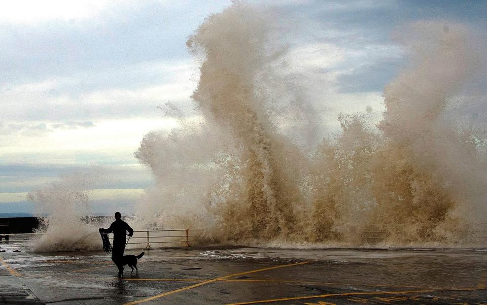 Strong winds in Aberystwyth, Wales, create huge waves along the coast