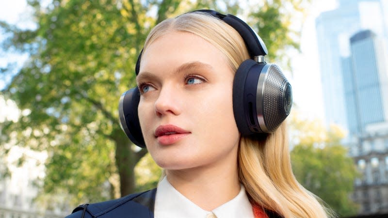 A user wearing the Dyson Zone headphones outside without the filtration visor attached.