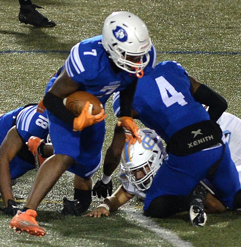 Dover's Rasheed Branch-Calhoun (7) recovers a fumble during the Senators' 35-7 win over Cape Henlopen on Friday night.