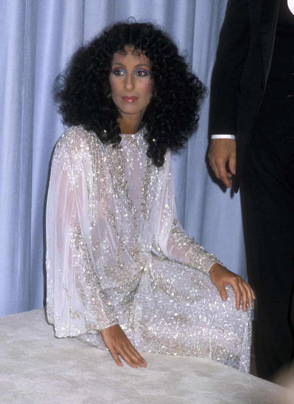 <p>In a sparkling gown and rainbow eye makeup at the Academy Awards.</p>