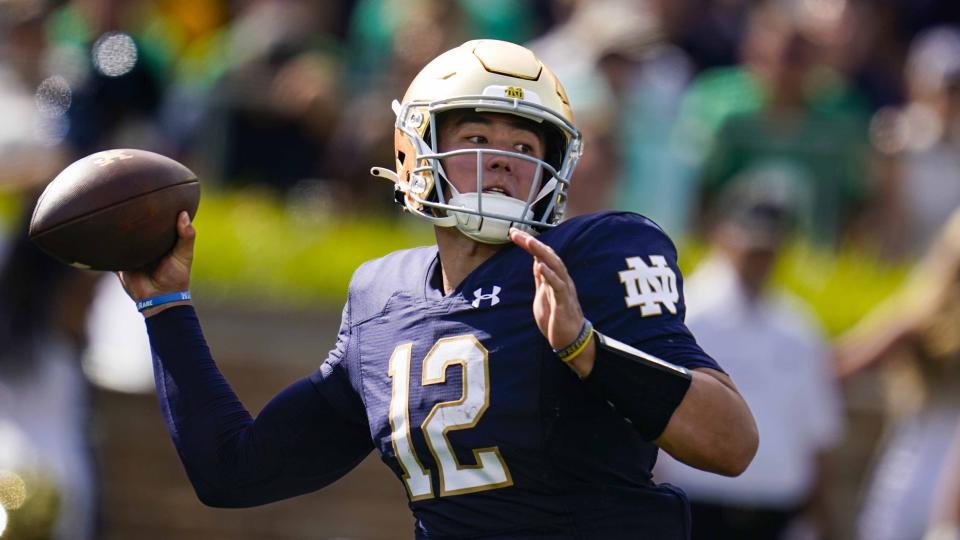 FILE - Then-Notre Dame quarterback Tyler Buchner (12) throws against Marshall during the first half of an NCAA college football game in South Bend, Ind., Saturday, Sept. 10, 2022. There’s more than the usual quarterback questions going into this season, and transfers who are hoping to provide some of the answers. Buchner transferred to Alabama. (AP Photo/Michael Conroy, File)