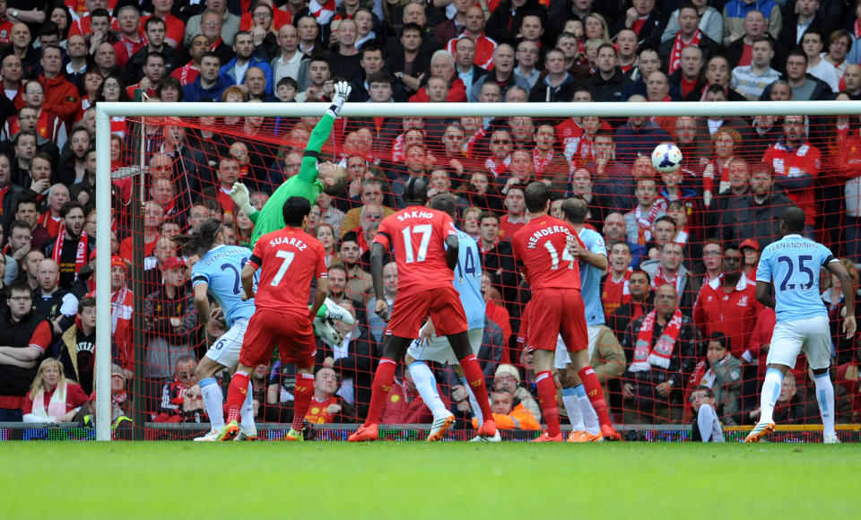 Liverpool's Martin Skrtel (not in shot) scores the second goal of the game for his side during their English Premier League soccer match against Manchester City at Anfield in Liverpool, England, Sunday April. 13, 2014. (AP Photo/Clint Hughes)