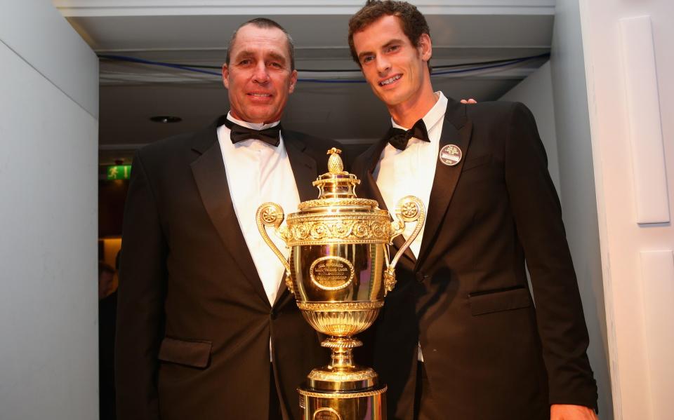 Andy Murray and Ivan Lendl pose with the Wimbledon trophy