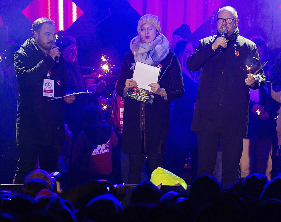 Gdansk Mayor Pawel Adamowicz,right, far right, speaks to an audience shortly before he was stabbed in Gdansk, Poland, on Sunday Jan. 13, 2019. Adamowicz was taken to a hospital in very serious condition after the attack and underwent surgery. (AP Photo/Anna Rezulak/KFP) POLAND AUT