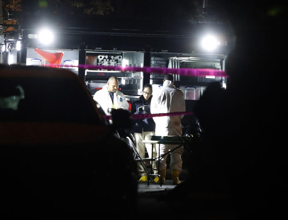 Police in hazmat suits inspect the Borderline Bar and Grill. Source: AAP