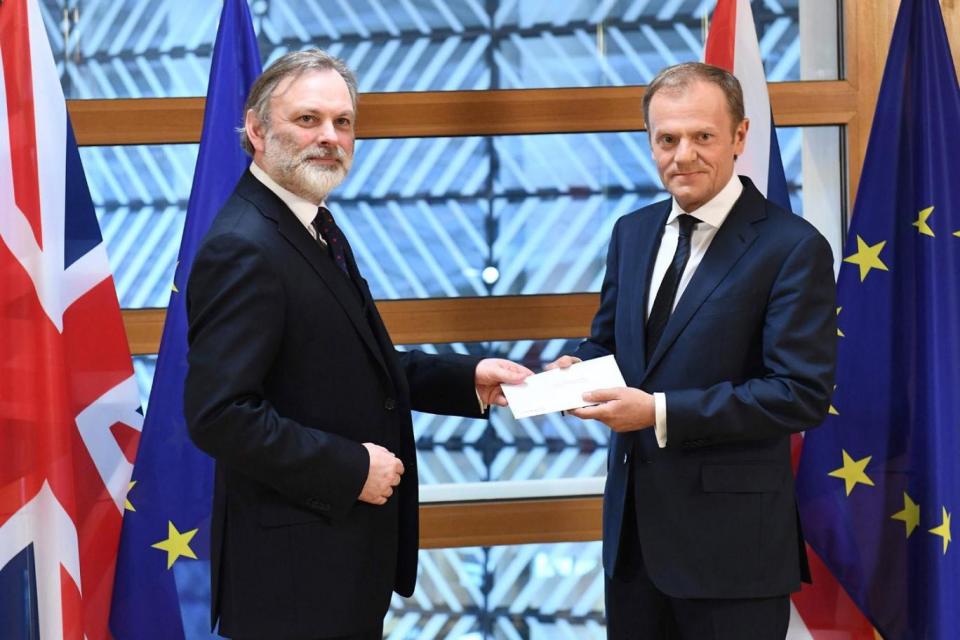 Sir Tim Barrow handed May's letter to the President of the European Council Donald Tusk on Wednesday (AFP/Getty Images)