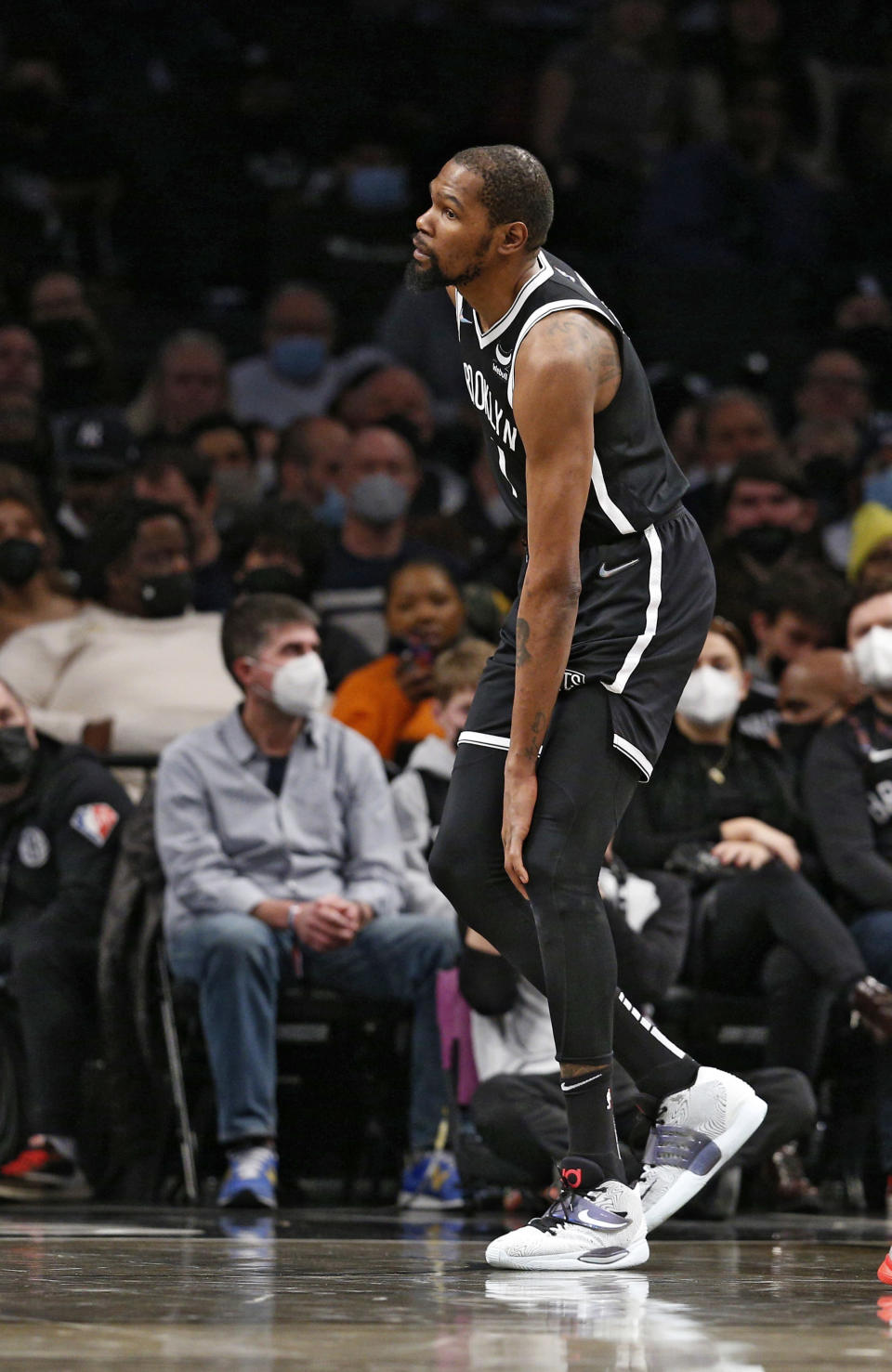 Brooklyn Nets forward Kevin Durant (7) grabs his knee after a collision against the New Orleans Pelicans during the first half of an NBA basketball game, Saturday, Jan. 15, 2022 in New York. (AP Photo/Noah K. Murray)