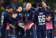 Cricket - ODI - New Zealand vs England - Seddon Park, Hamilton, New Zealand, February 25, 2018. England's Ben Stokes celebrates with team mates after dismissing New Zealand's Colin de Grandhomme during their one-day international match. REUTERS/Ross Setford