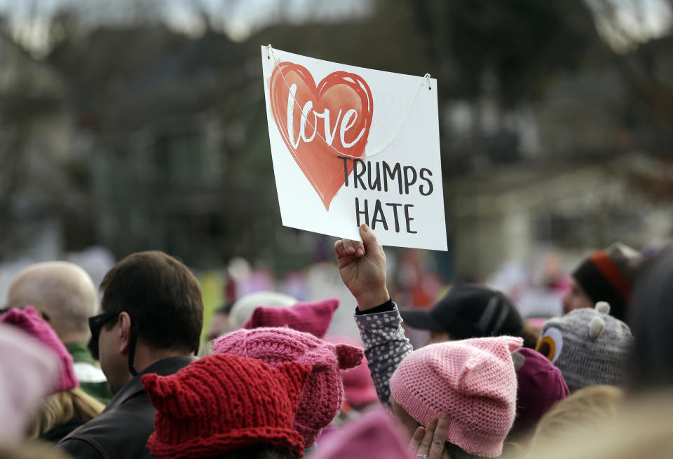 A protester in Seattle holds up a sign before a Women’s March of tens of thousands on Jan. 21, 2017. (AP Photo/Elaine Thompson)