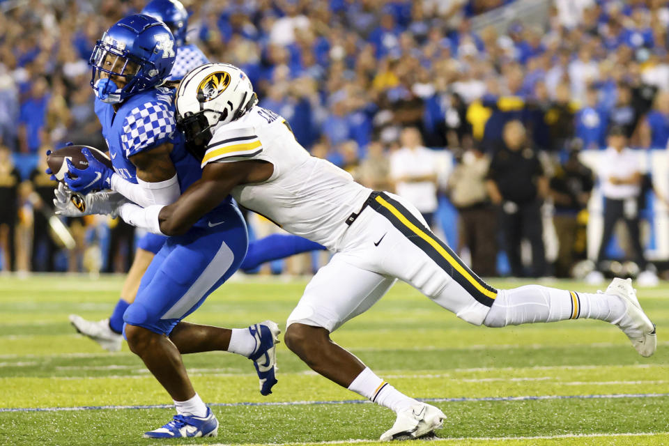 Kentucky wide receiver Wan'Dale Robinson (1) gets tackled during the first half of an NCAA college football game against Missouri in Lexington, Ky., Saturday, Sept. 11, 2021. (AP Photo/Michael Clubb)