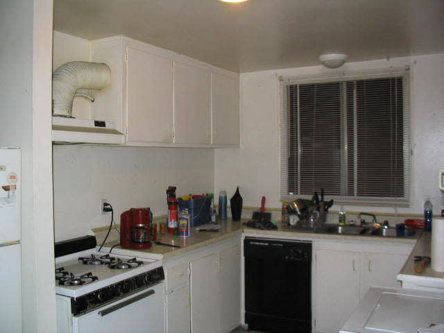 Before: Dingy kitchen in the upper unit