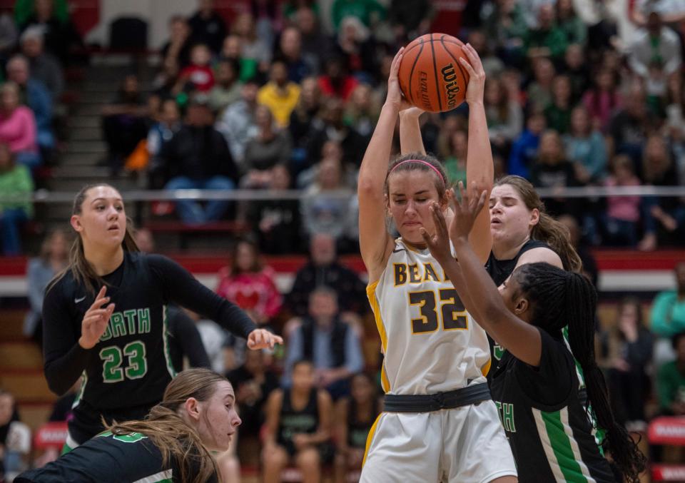 Central’s Maddy Shirley (32) pulls down a rebound as the Central Lady Bears play the North Lady Huskies in the 2024 IHSAA Class 4A Girls Basketball Sectional 16 championship game at Harrison High School in Evansville, Ind., Saturday, Feb. 3, 2024.