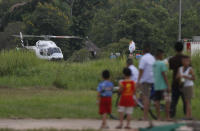 <p>A helicopter believed to be carrying one of the boys rescued from the flooded cave lands in Chiang Rai as divers continue to extract the remaining boys and their coach trapped at Tham Luang cave in the Mae Sai district in Chiang Rai province, northern Thailand, Tuesday, July 10, 2018. (Photo: Vincent Thian/AP) </p>