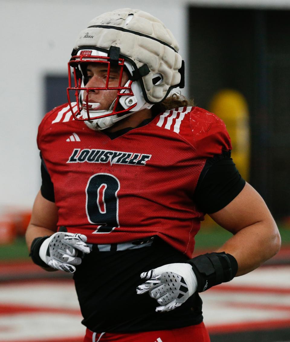 Louisville’s Ashton Gillotte warms up for Spring Practice on Thursday.
April 4, 2024