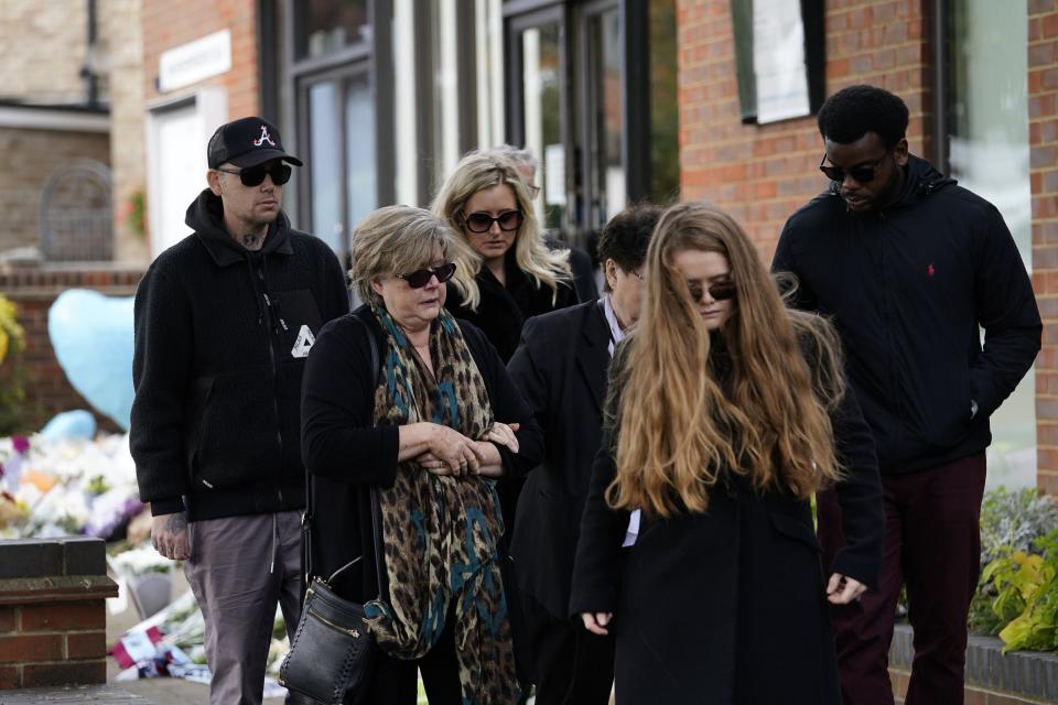 Julia Amess (second right) the widow of Conservative MP Sir David Amess, arrives with friends and family members to view flowers left for her late husband at Belfairs Methodist Church (PA)
