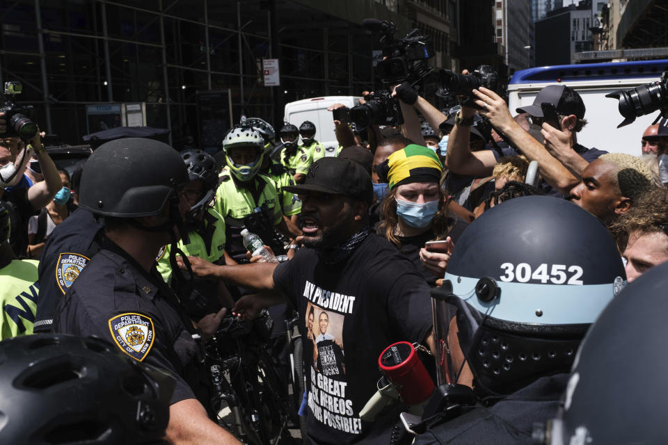 Black Lives Matter protesters and NYPD officers have confrontation near City Hall Park, Wednesday, July 15, 2020, in New York. (AP Photo/Yuki Iwamura)