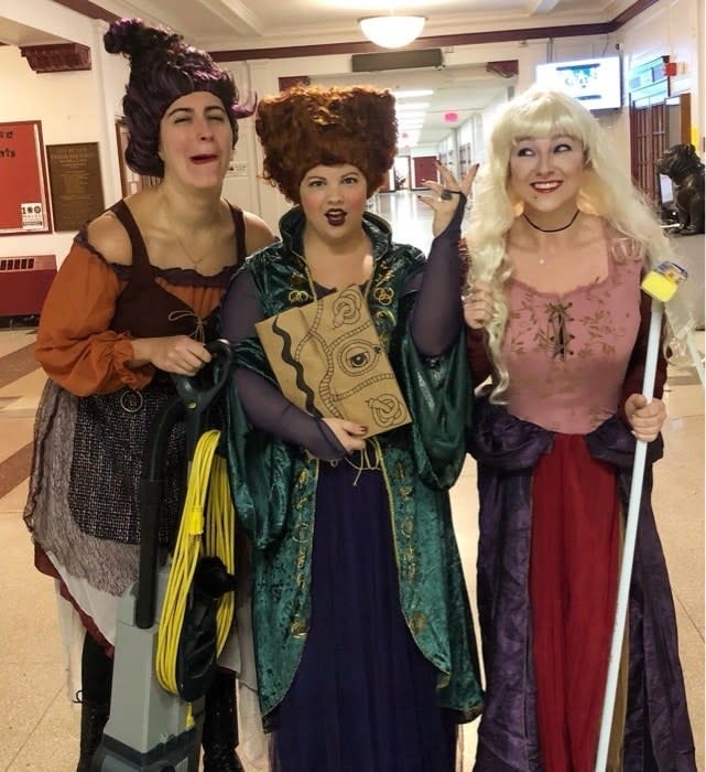 Three teachers dressed as the Sanderson Sisters from "Hocus Pocus"