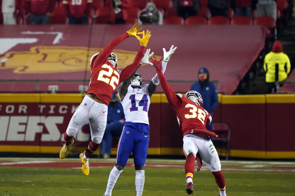 Kansas City Chiefs safety Juan Thornhill (22) and safety Tyrann Mathieu (32) break up a pass intended for Buffalo Bills wide receiver Stefon Diggs (14) during the second half of the AFC championship NFL football game, Sunday, Jan. 24, 2021, in Kansas City, Mo. (AP Photo/Jeff Roberson)