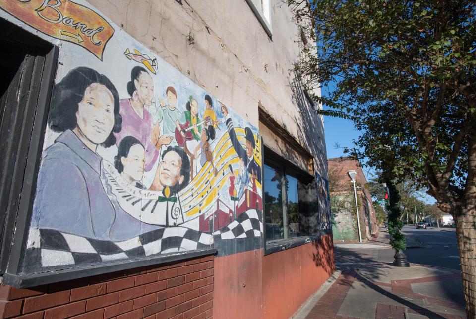 A mural celebrates the history of the Belmont-DeVilliers neighborhood along West Belmont Street in Pensacola on Tuesday, Nov. 15, 2022.