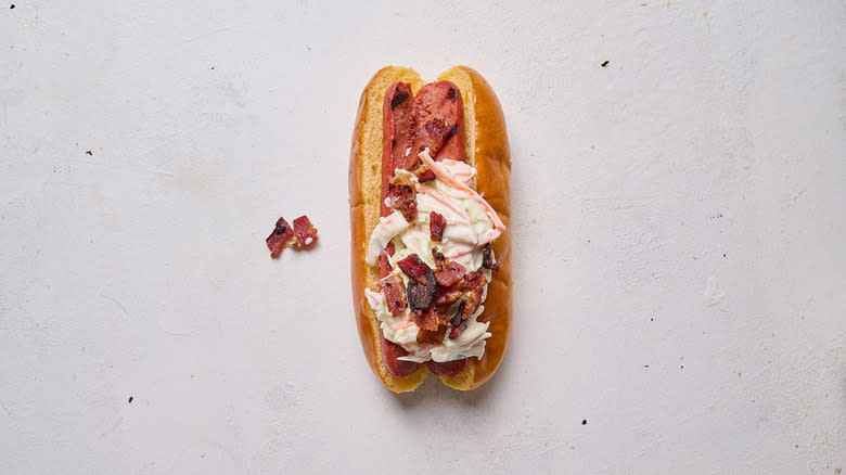 hot dog with coleslaw and bacon