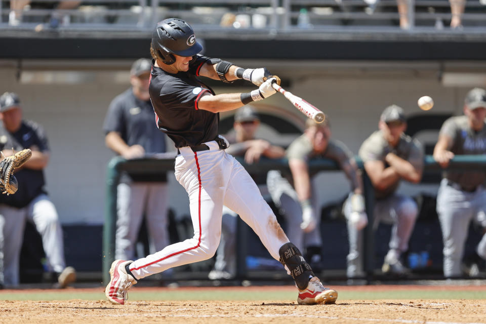 FILE - Georgia's Charlie Condon hits the ball during an NCAA regional baseball game against Army on May 31, 2024 in Athens, Ga. The Cleveland Guardians have the No. 1 overall pick in next week's draft. They have narrowed the talent pool to just a few possibilities with Oregon State second baseman Travis Bazzana, Georgia outfielder/third baseman Condon and West Virginia middle infielder Wetherholt believed to be the frontrunning options. (AP Photo/Stew Milne, File)