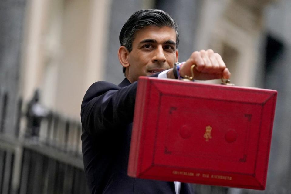 Chancellor of the Exchequer Rishi Sunak holds his ministerial ‘Red Box’ as he stands with his ministerial team and Parliamentary Private Secretaries, outside 11 Downing Street, London, before delivering his Budget to the House of Commons. Picture date: Wednesday October 27, 2021. (PA Wire)