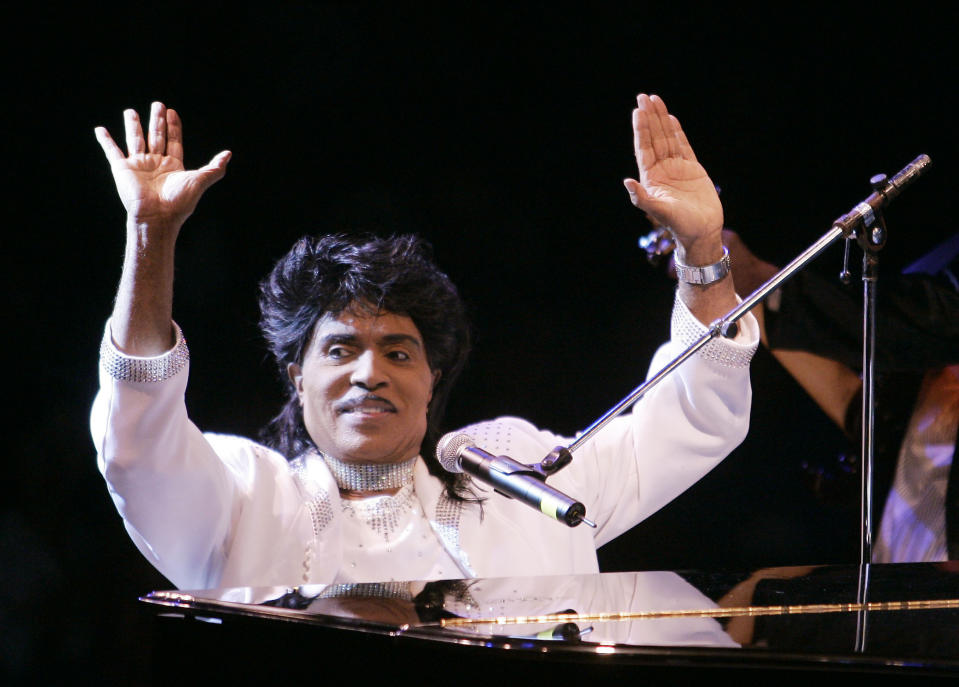 FILE - In this Aug. 19, 2004 file photo, Little Richard performs at Westbury Music Fair in Westbury, NY. Little Richard, the self-proclaimed “architect of rock ‘n’ roll” whose piercing wail, pounding piano and towering pompadour irrevocably altered popular music while introducing black R&B to white America, has died Saturday, May 9, 2020. (AP Photo/Ed Betz, File)