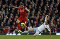 Liverpool's Steven Gerrard (L) challenges West Ham United's Mark Noble during their English Premier League soccer match at Anfield in Liverpool, northern England December 7, 2013. REUTERS/Phil Noble