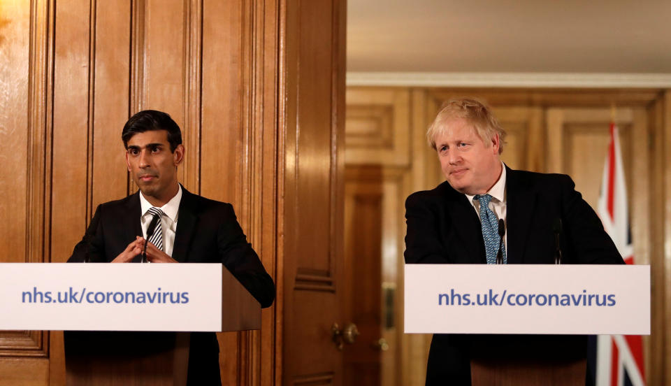 Britain's Prime Minister Boris Johnson and Chancellor of the Exchequer Rishi Sunak attend a news conference on the ongoing situation with the coronavirus disease (COVID-19) in London, Britain March 17, 2020. Matt Dunham/Pool via REUTERS