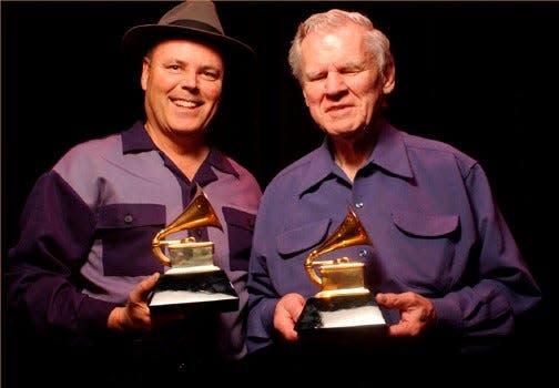 David Holt (left) and Doc Watson (right) with their Grammy awards.