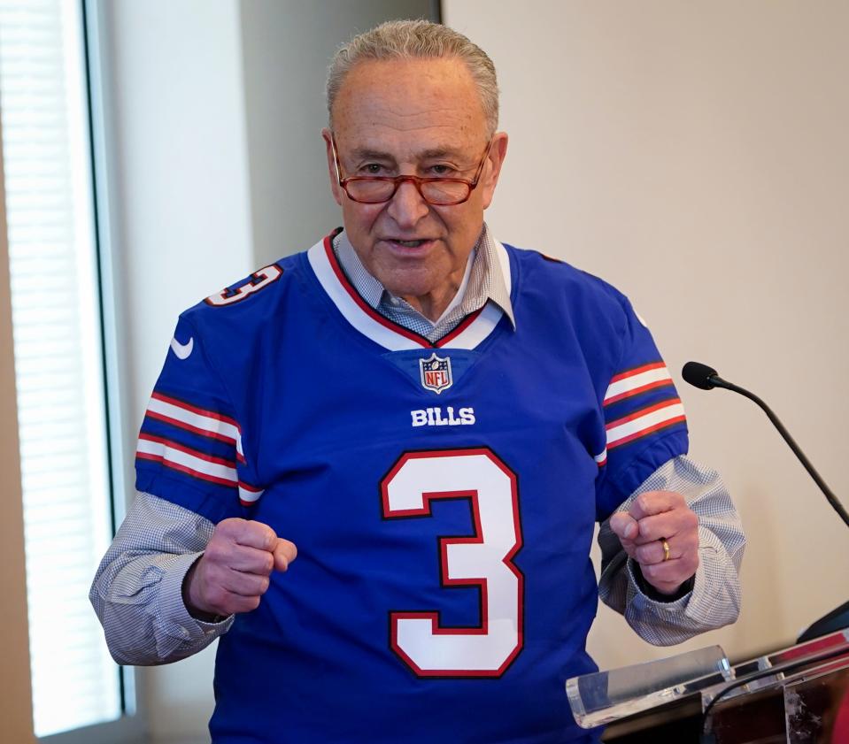 Senate Majority Leader Chuck Schumer, D-N.Y.,  wears a Buffalo Bills jersey given to him by Damar Hamlin at an event in Washington, D.C. to advocate for legislation that would provide money for AEDs and training in schools. March 29, 2023.