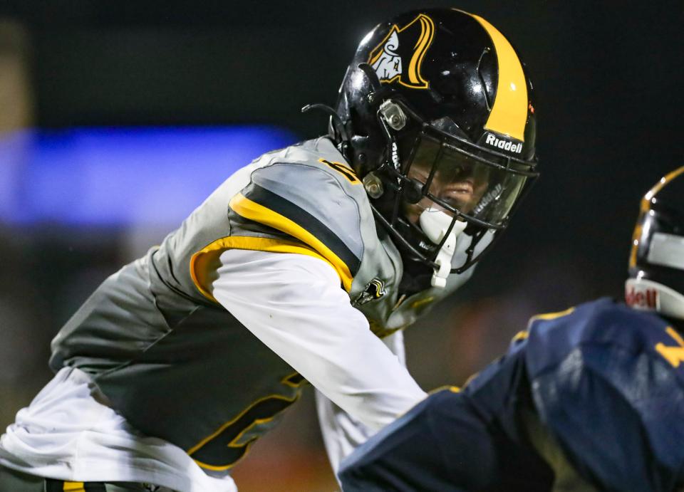 American Heritage Patriots defensive back Xavier Thomas (2) guards a Naples Golden Eagles receiver during the third quarter of a game at Staver Field in Naples on Friday, Sept. 13, 2024.