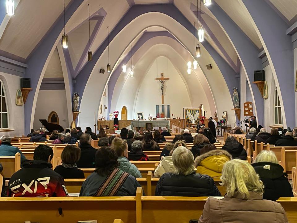 More than 100 people gathered Wednesday night at St. Joseph's Cathedral in Fort Smith for a candle vigil to remember those who died in the plane crash.