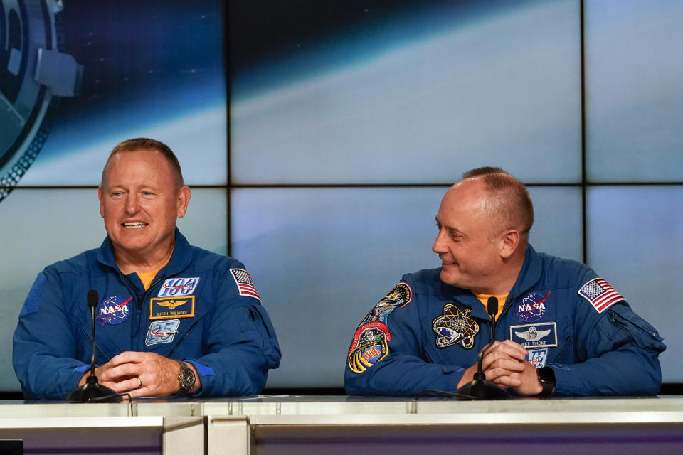 NASA astronauts Butch Wilmore, left, and Mike Fincke answer questions during a news conference at the Kennedy Space Center in Cape Canaveral, Fla., Wednesday, May 18, 2022. (AP Photo/John Raoux)