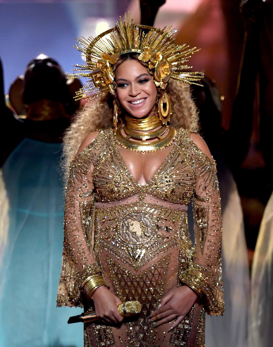 <p>Between the gold crown, earrings, and layers of choker necklaces, Beyoncé knows that bling is best. (Photo: Getty Images) </p>