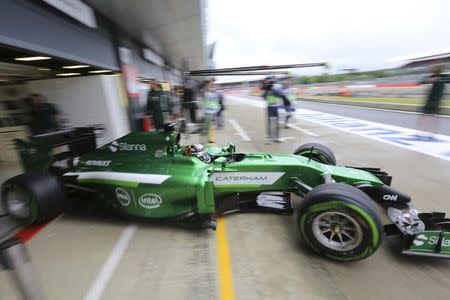Caterham Formula One driver Kamui Kobayashi of Japan drives out from the pits during final practice ahead of the British Grand Prix at the Silverstone Race Circuit, central England, July 5, 2014. REUTERS/Paul Hackett