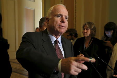 Sen. John McCain (R-AZ) talks to the media about the annual defense policy bill on Capitol in Washington June 18, 2015. REUTERS/Yuri Gripas