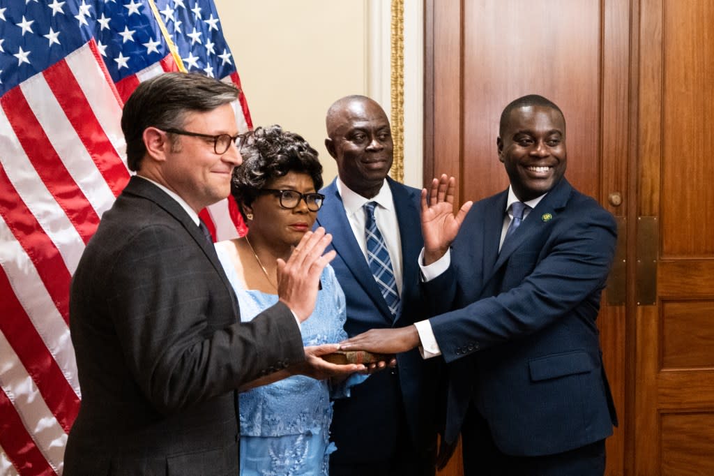 WASHINGTON – NOVEMBER 12: Speaker of the House Mike Johnson, R-La., left, participates in the ceremonial swearing in of Rep. Gabe Amo, D-R.I., right, in the Capitol on Monday, November 13, 2023. (Bill Clark/CQ-Roll Call, Inc via Getty Images)