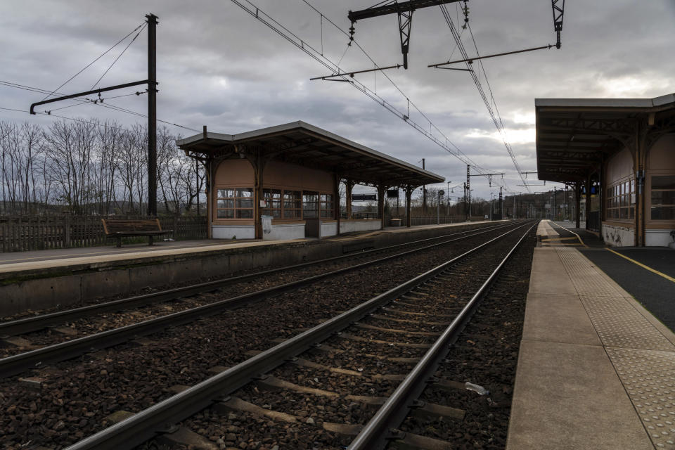An empty platform is pictured during a railway strike at the Saint Germain au Mont d'Or train station, around Lyon, central France, Monday, Dec. 9, 2019. French commuters inched to work Monday through exceptional traffic jams, as strikes to preserve retirement rights halted trains and subways for a fifth straight day. Citing safety risks, the SNCF national rail network issued warned travelers to stay home or use "alternate means of locomotion" to get to work Monday instead of thronging platforms in hopes of getting the few available trains. (AP Photo/Laurent Cipriani)
