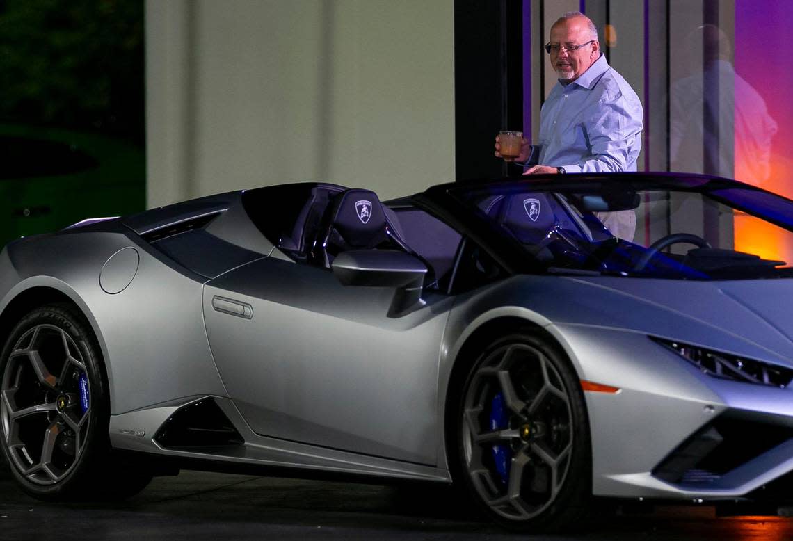 A customer looks at a Lamborghini Huracán EVO Spyder on display at the Lamborghini Broward dealership on Jan. 30, 2023, in Davie.