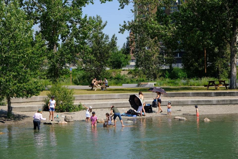 Families spent Tuesday afternoon cooling off in the river at St. Patrick’s Island Park in Calgary. 