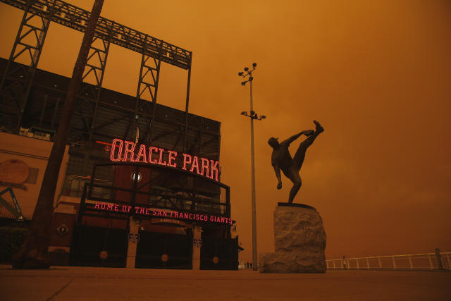 The San Francisco Giants and Oakland Athletics played their respective home games Wednesday night under an ominous orange sky caused by wildfires burning across Northern California. (Photo by Lachlan Cunningham/Getty Images)
